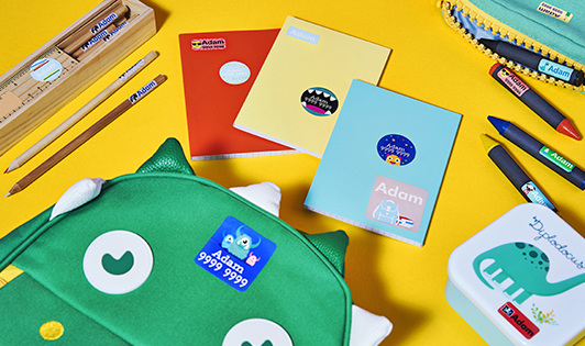School backpack and books on a yellow background